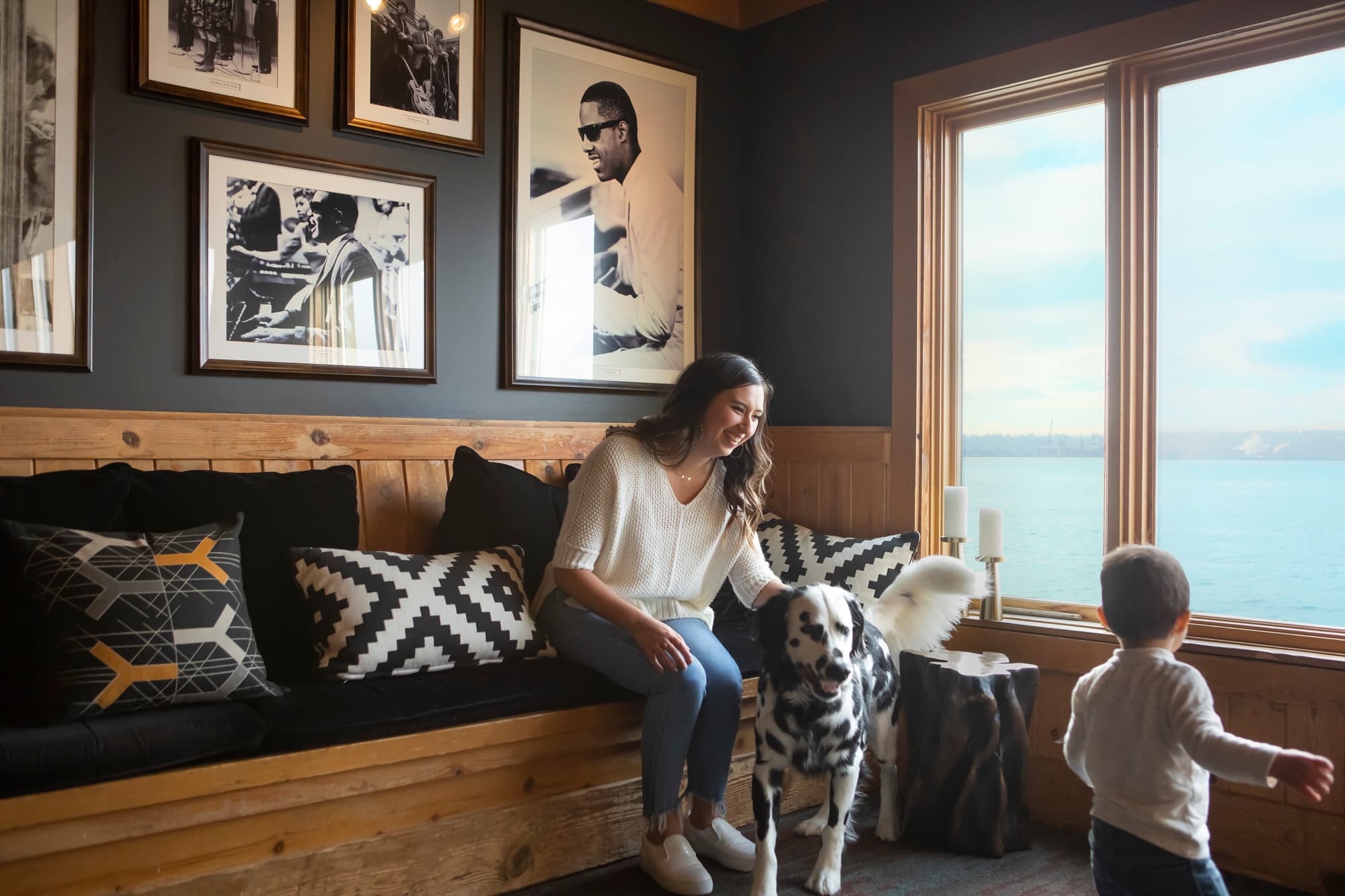 A woman with her dog and child in a suite at The Edgewater