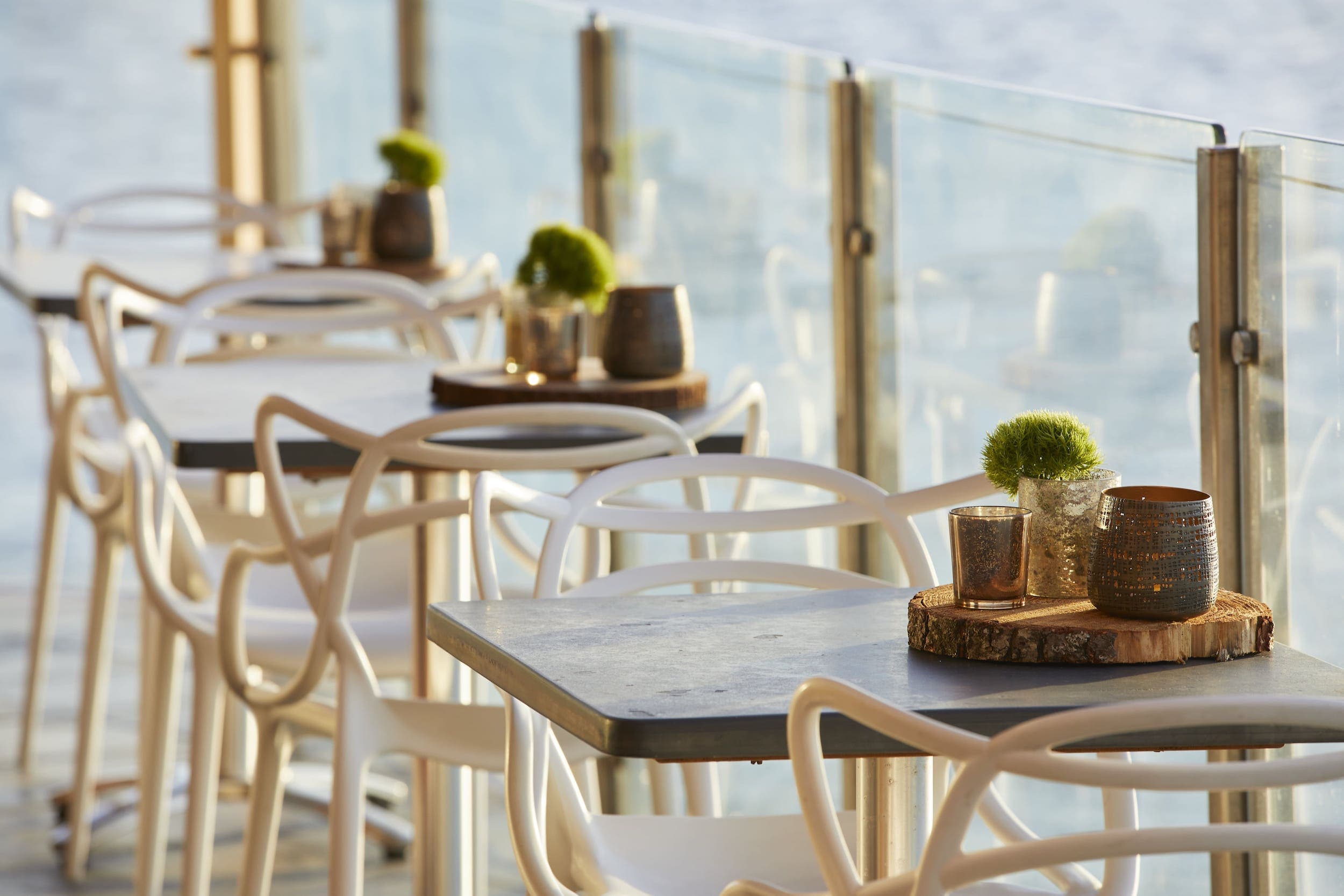 The outside dining area of Six Seven Restaurant overlooking the water at Edgewater