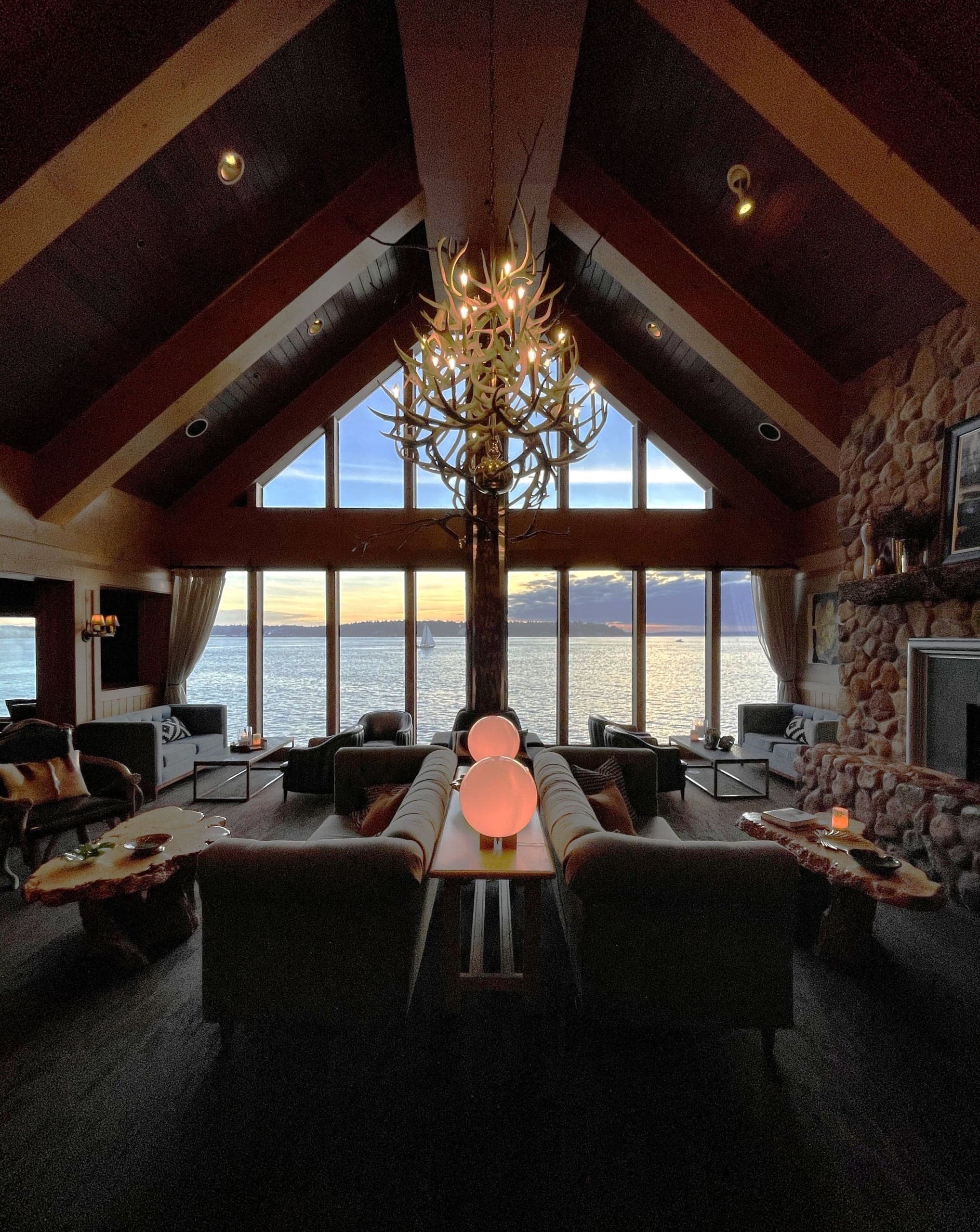 The Edgewater lobby view at sunset with ambient lighting overlooking the water