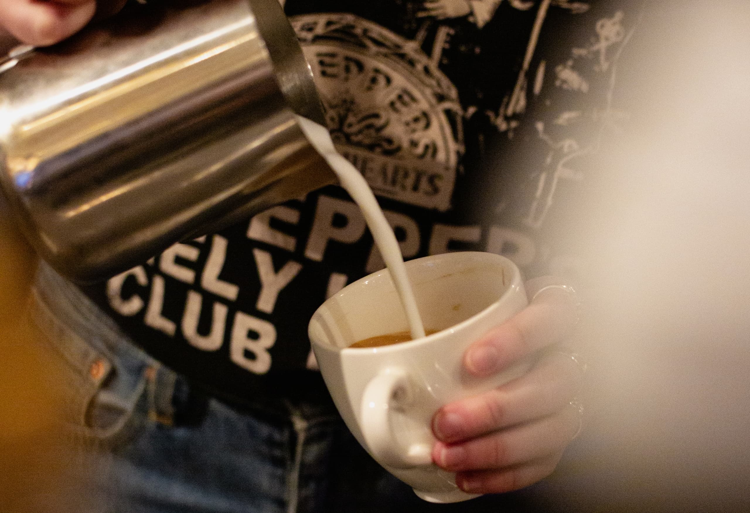 A barista pouring a drink at The Edgewater