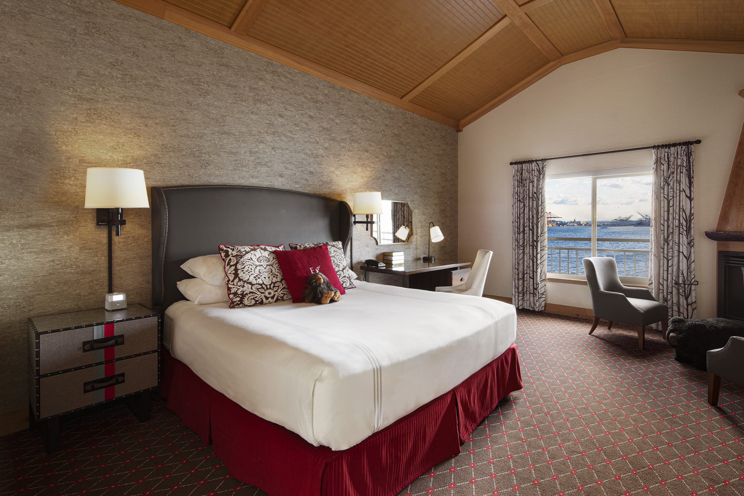 A king bed room with a balcony over looking the water at Edgewater