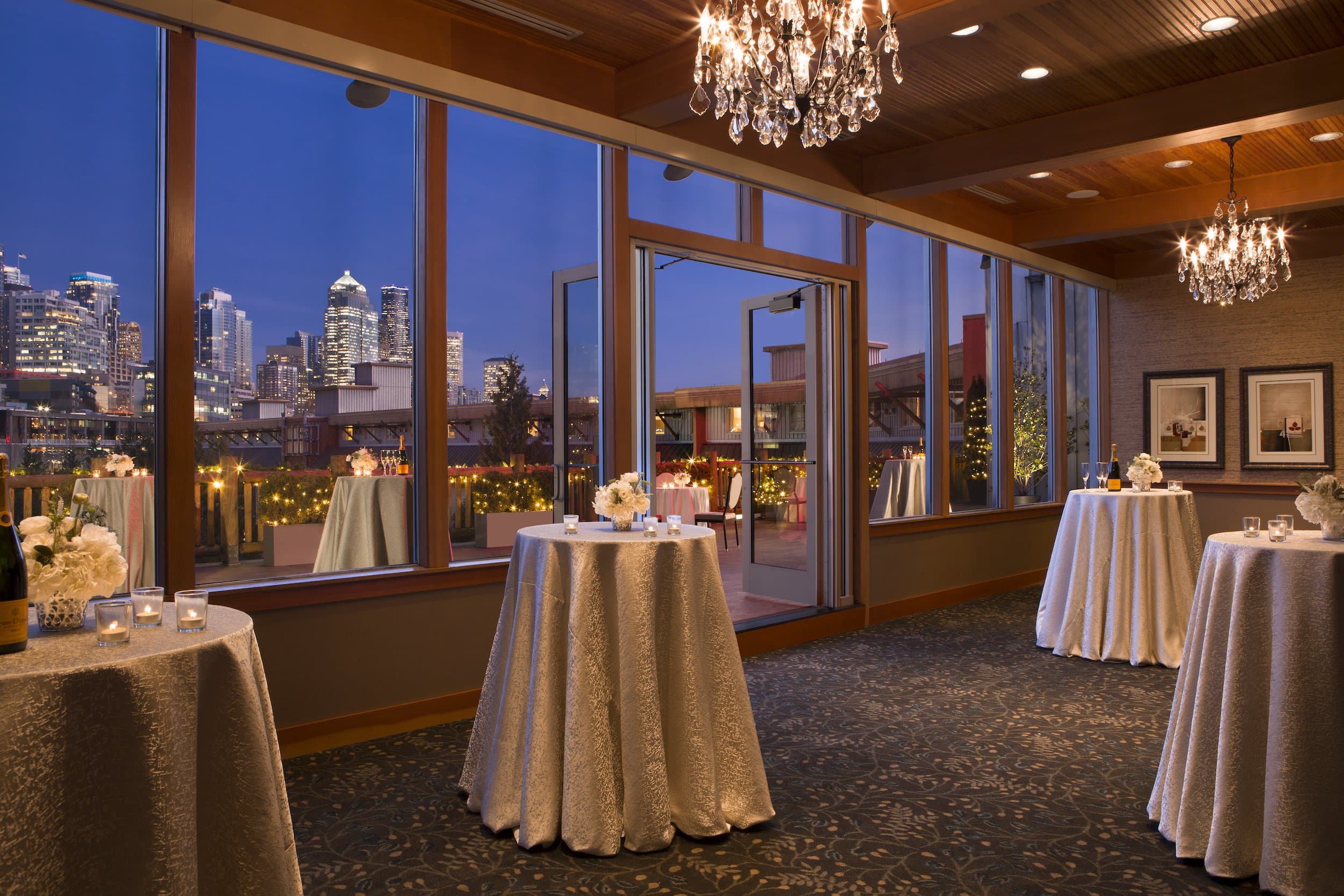 The Terrace Room at night with a gorgeous view of the city.
