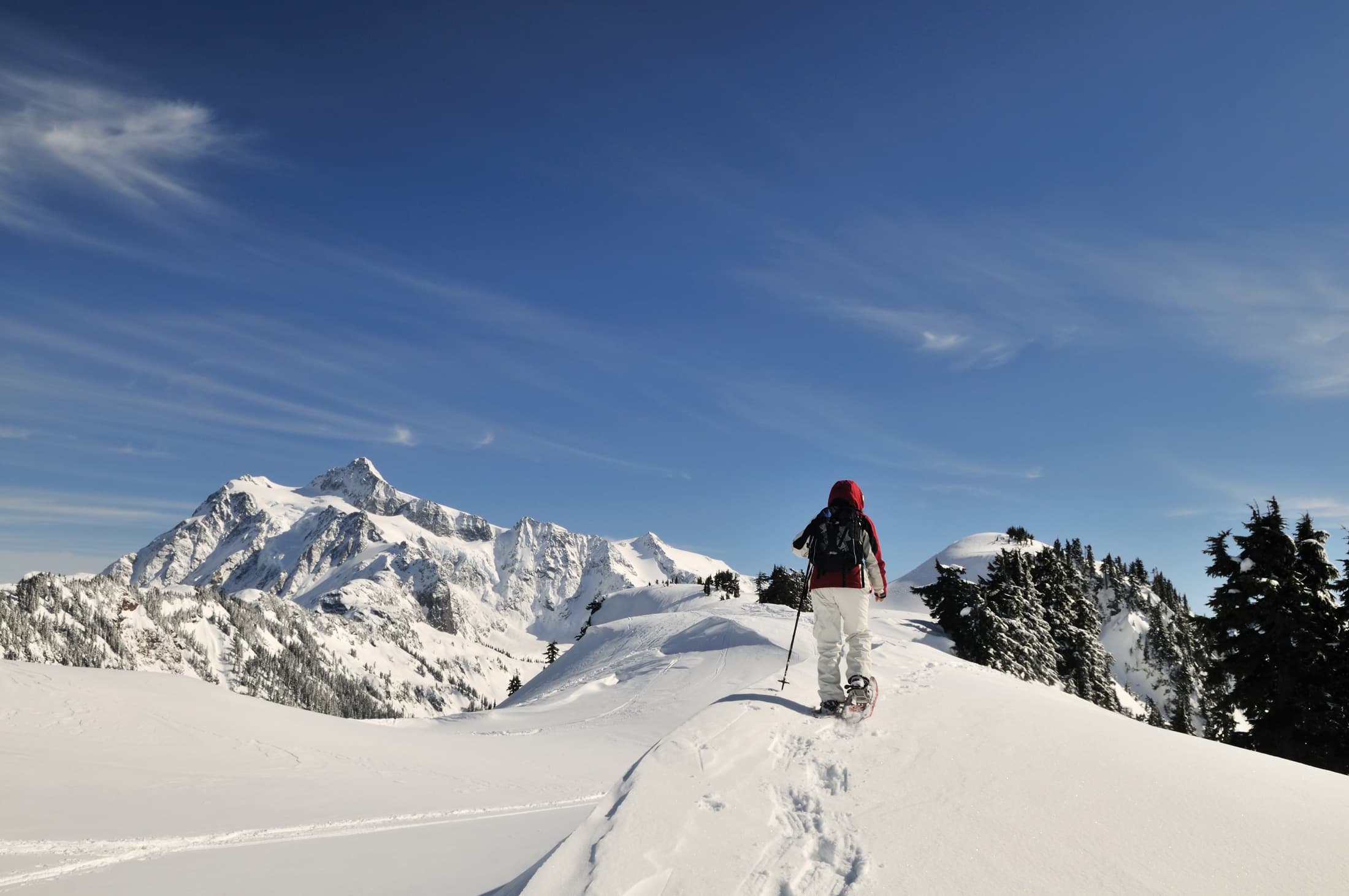 a man skiing on top of mountain