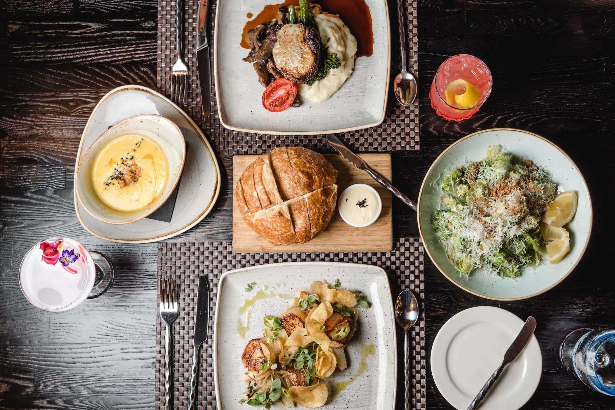 A variety of dinner dishes and cocktails at Six Seven