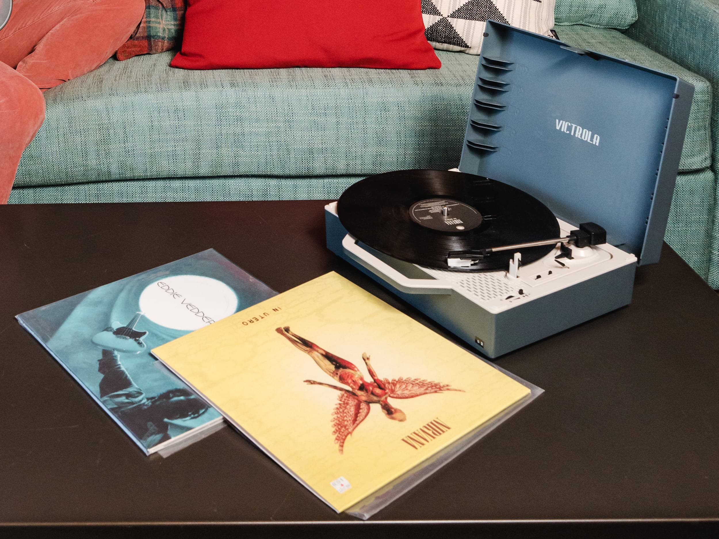A suitcase record player and Nirvana vinyl records in a suite at Edgewater