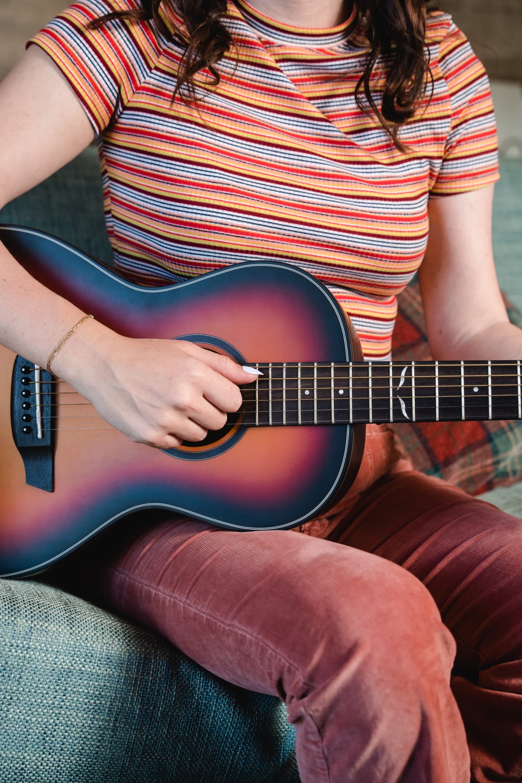 A woman playing guitar