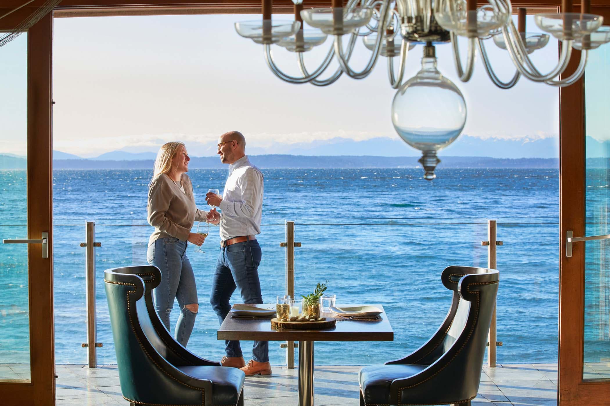 A couple engaging on the patio outside the restaurant having a few drinks