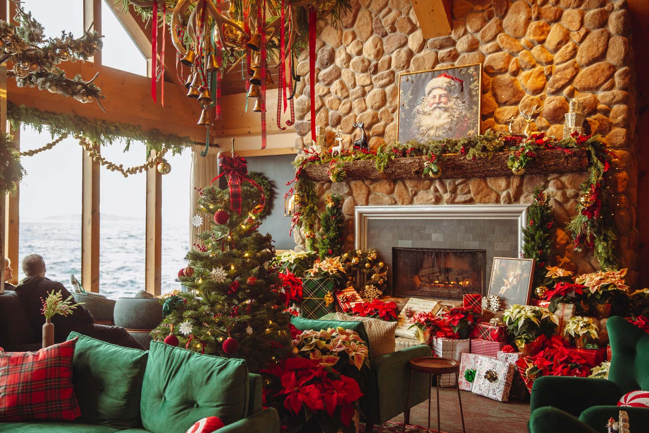 The fireplace and lobby area of Edgewater decorated for the holidays from floor to ceiling