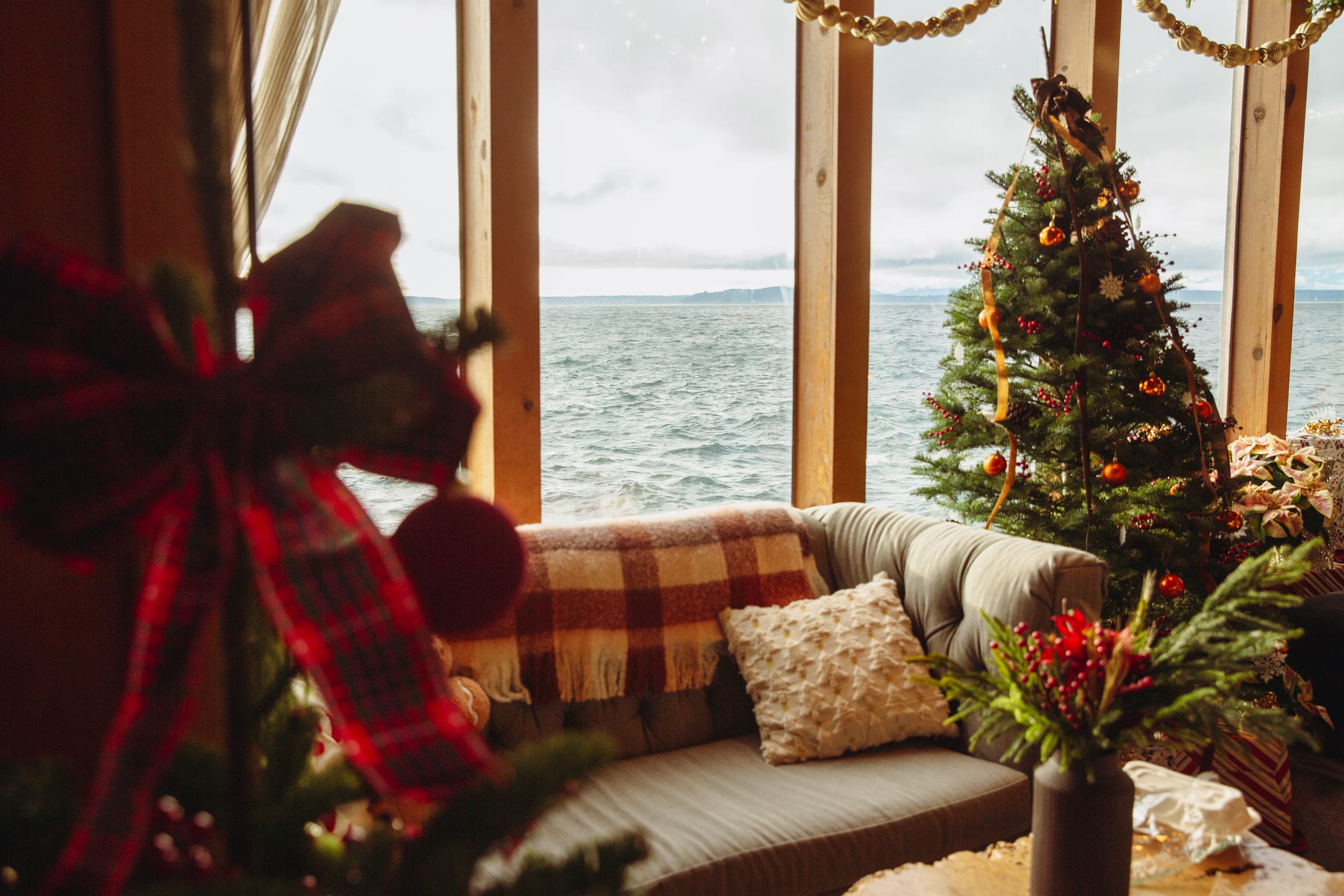 A Christmas tree in the lobby and a view of the water