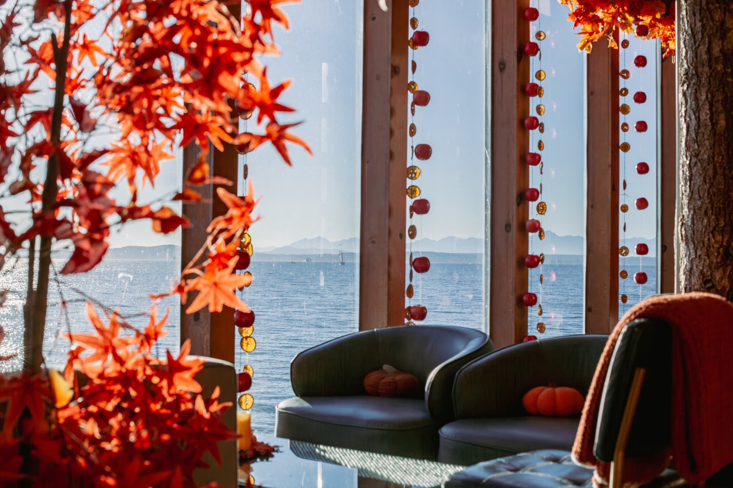 A view of the water in the lobby with autumn window decorations