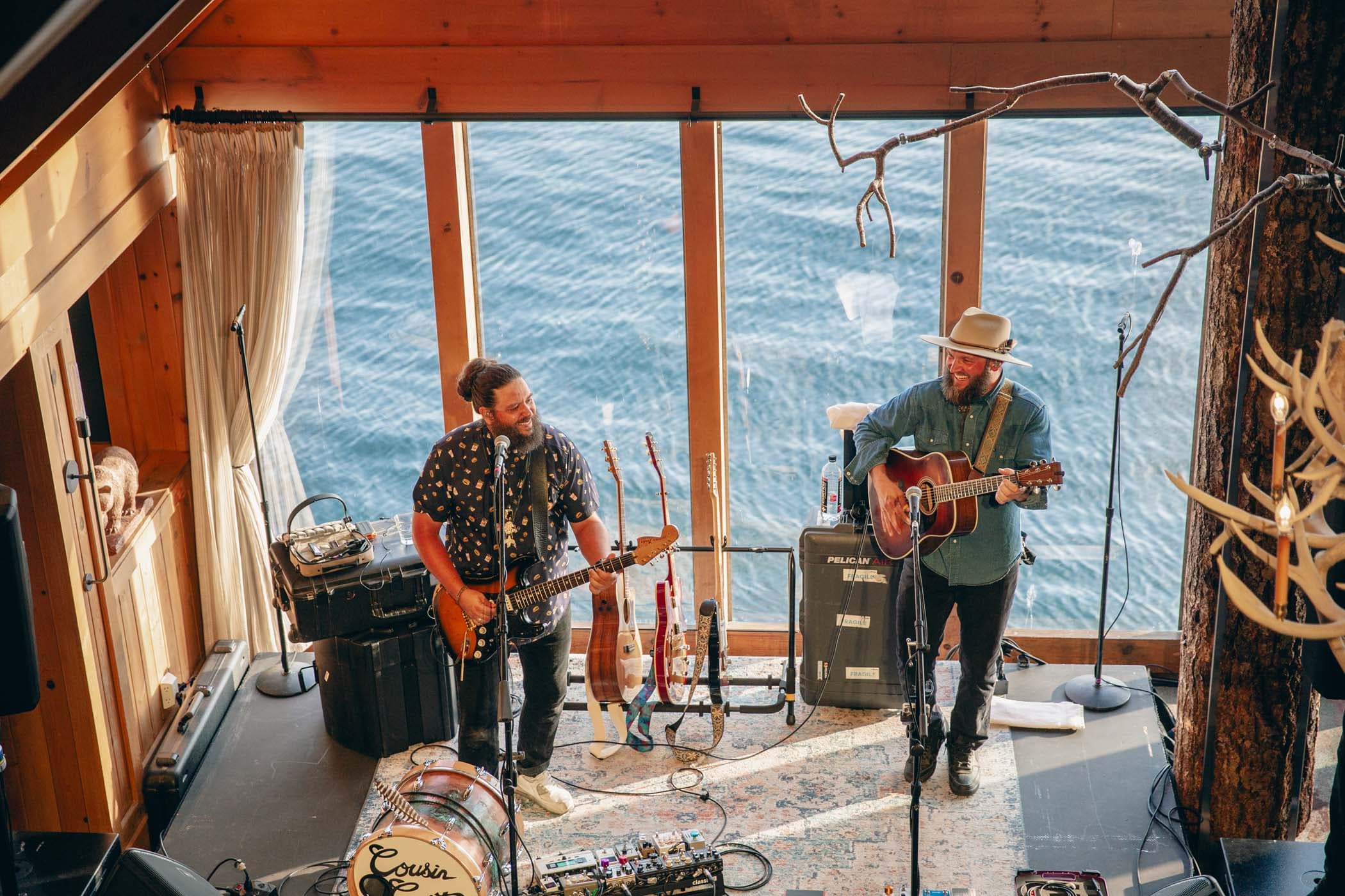 Two men playing music at Edgewater in the lobby
