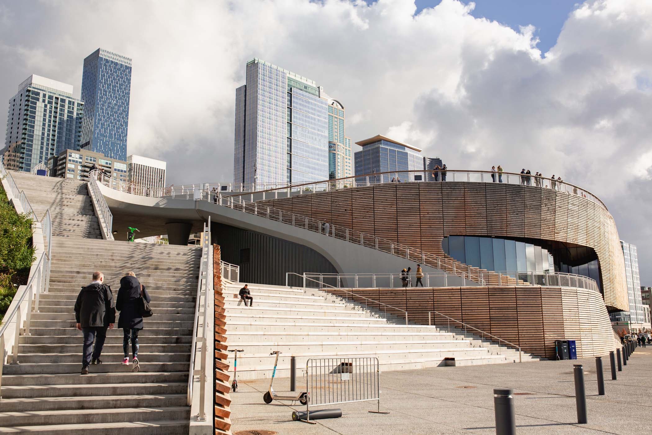 A large modern architecturally beautiful set of stairs and structure on a boardwalk