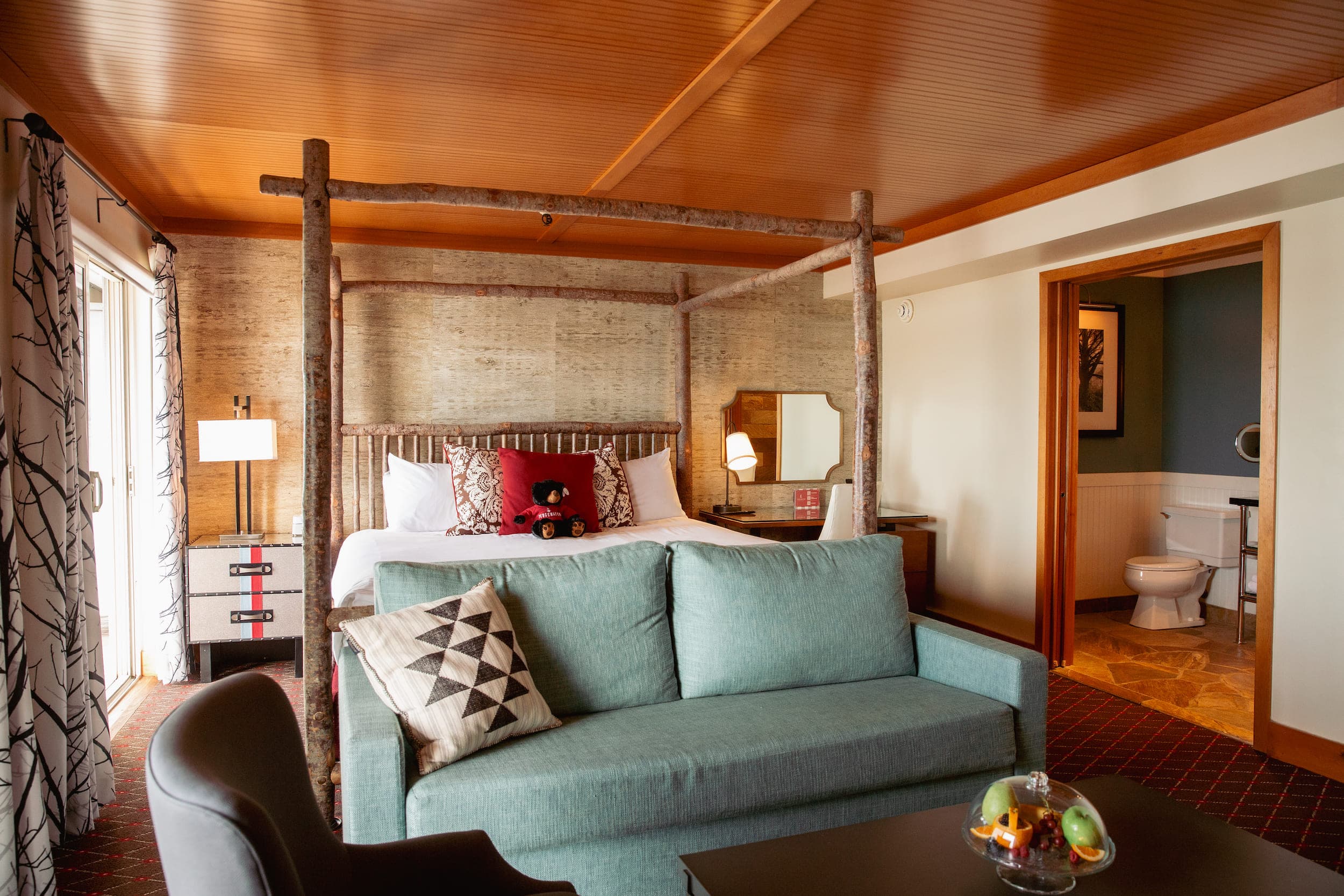 The bed and bathroom of a suite at Edgewater