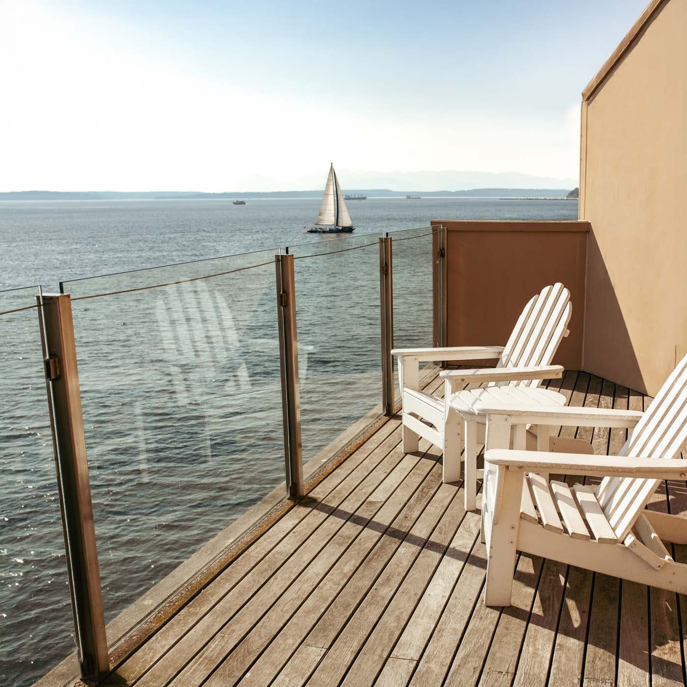A large balcony overlooking the water from the Penthouse suite at Edgewater