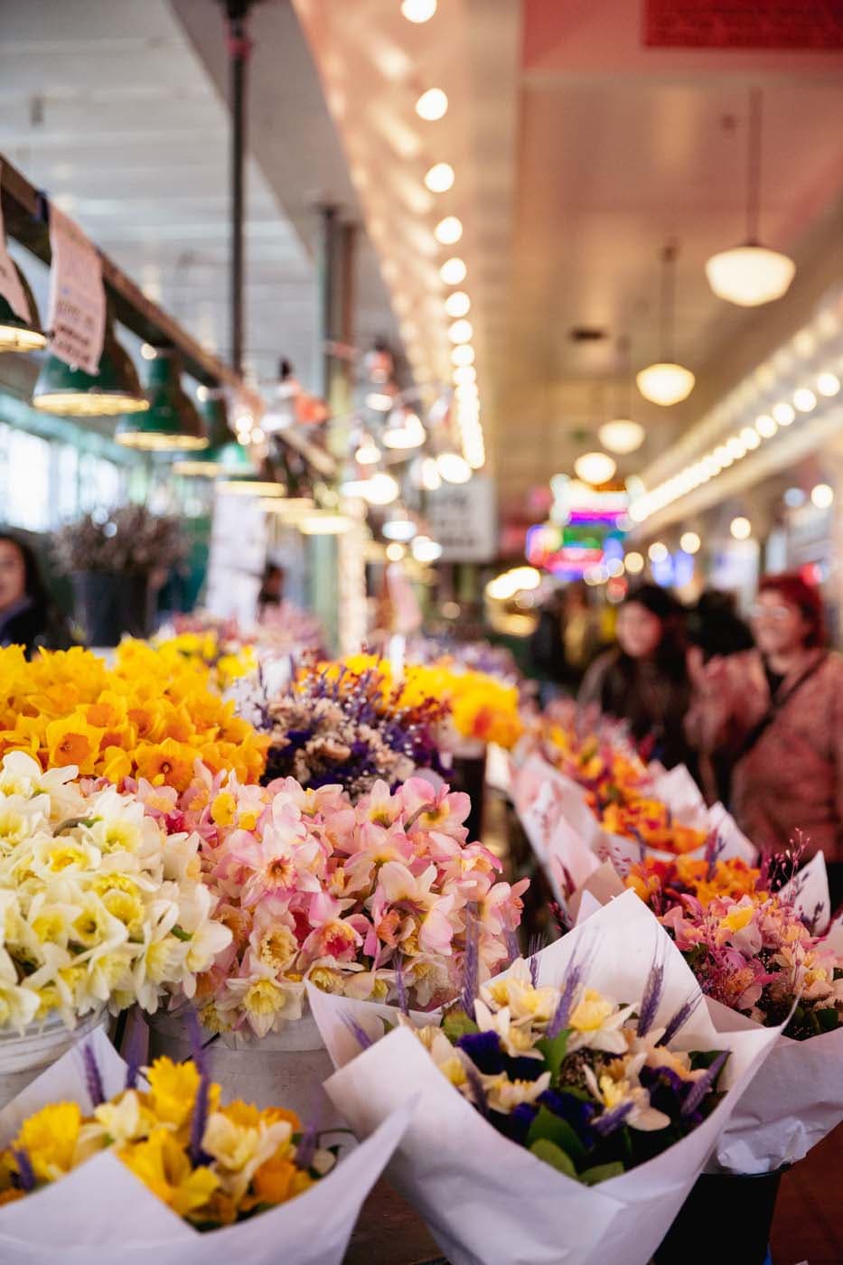 A bunch of flowers set up in the Pike Place Market