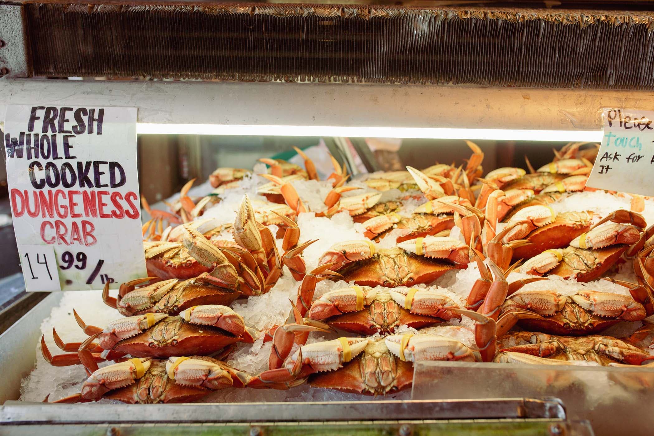 A cold table full of Dungeness crab at Pike Place Market