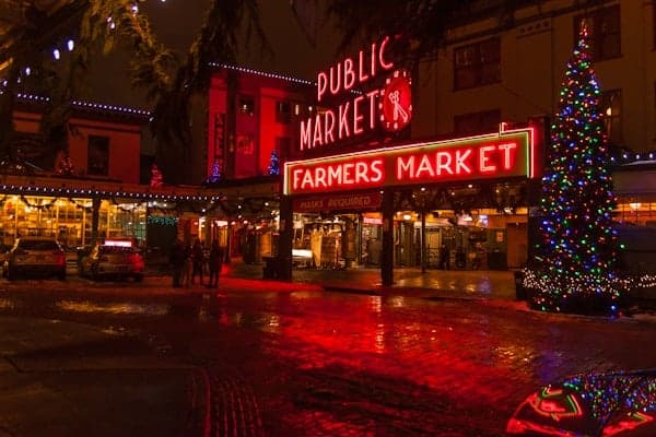 The Public Market and Farmers Market sign lit up at night