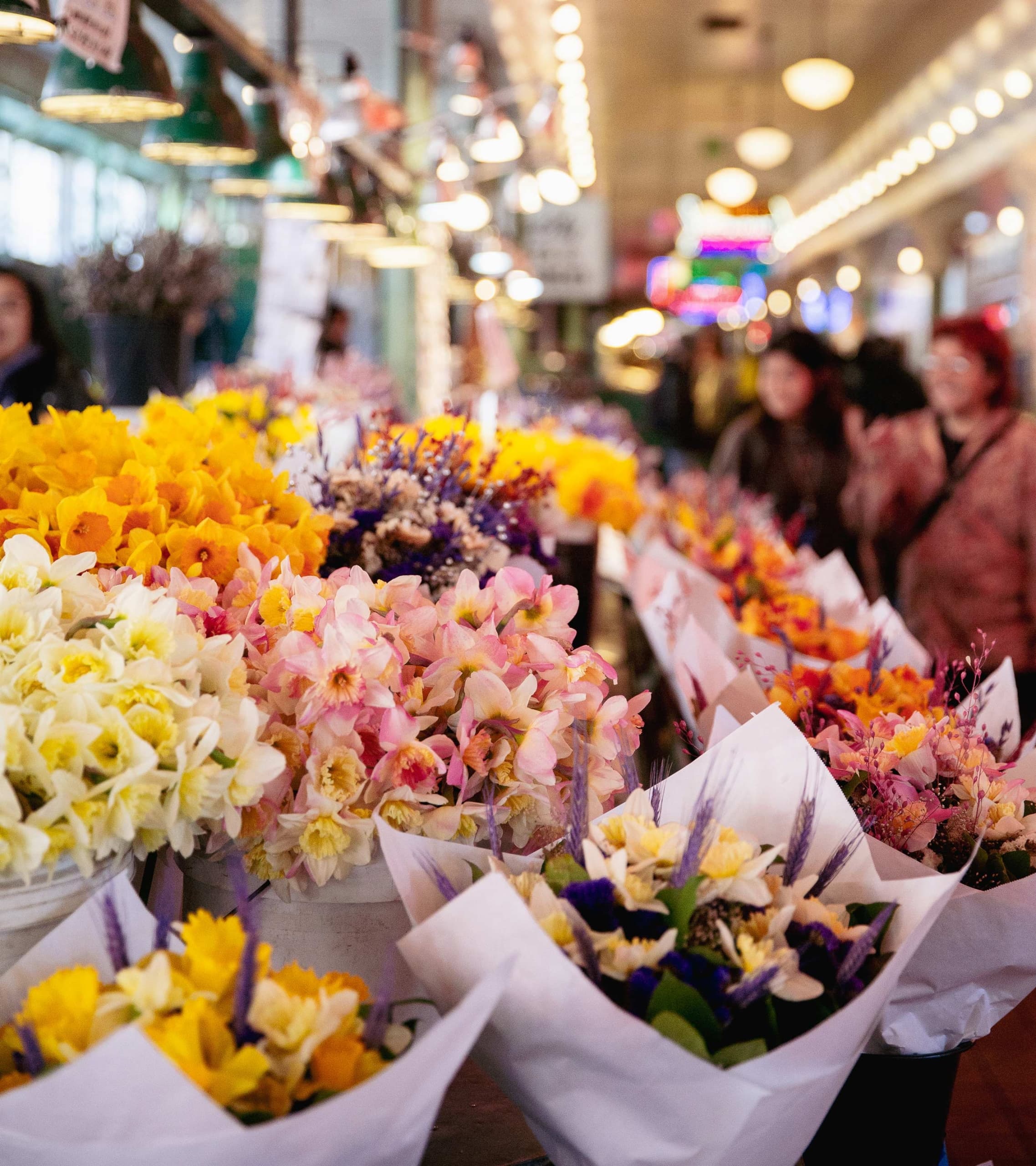 A bunch of flowers set up in the Pike Place Market