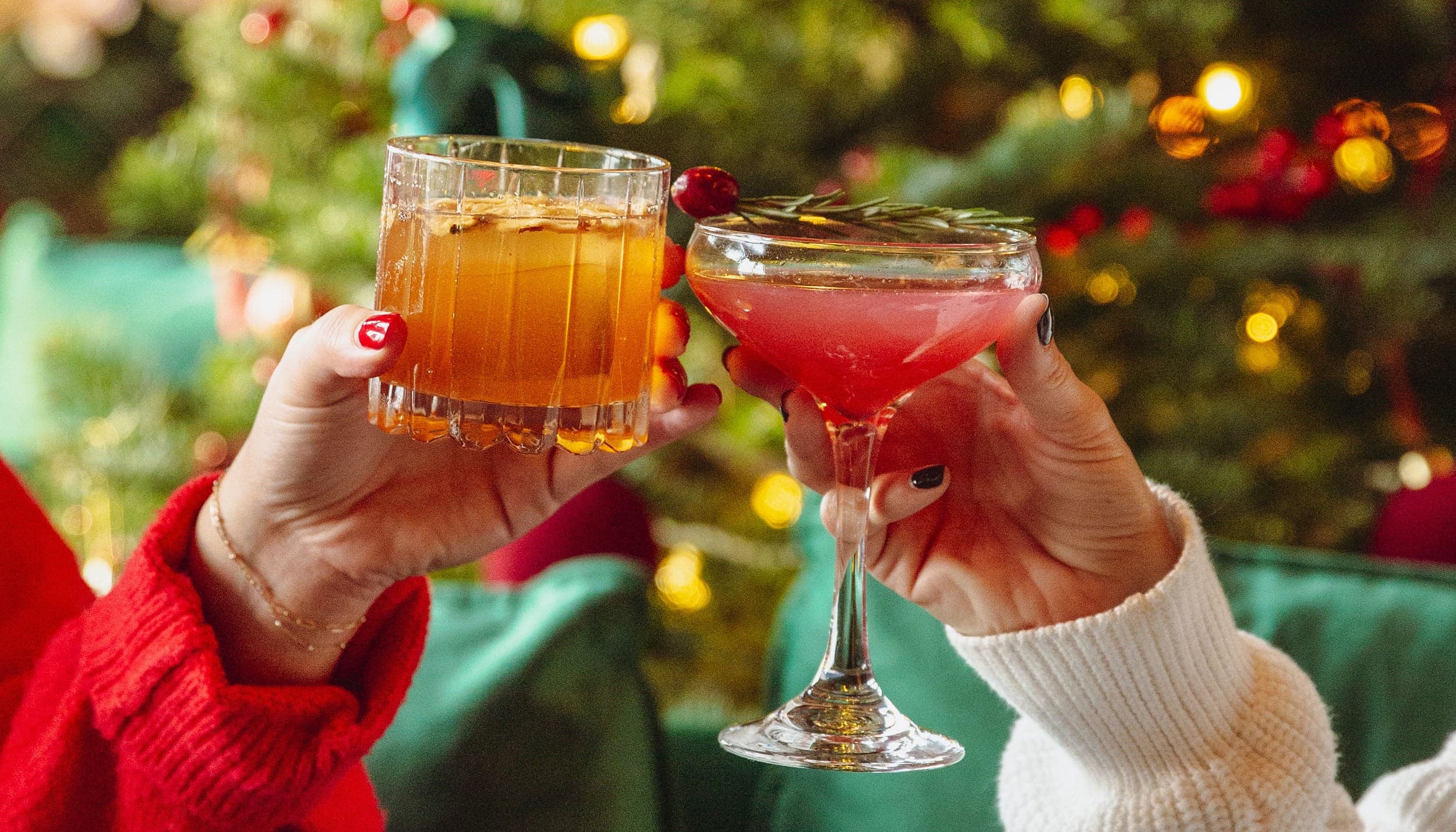 Holiday cocktails toasted beside a Christmas tree at The Edgewater Hotel bar in Seattle