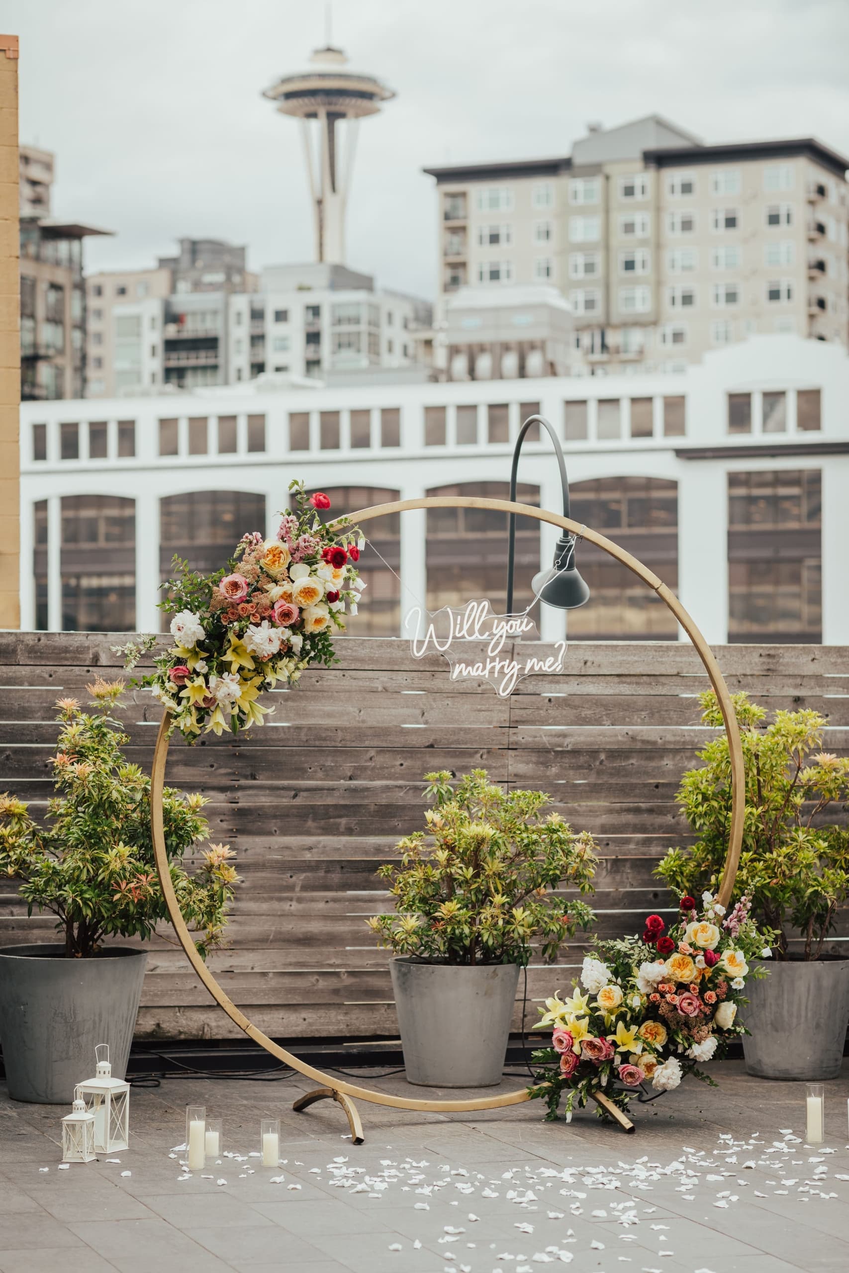 Beautiful wedding decor including candles, flowers and a Seattle backdrop at Edgewater