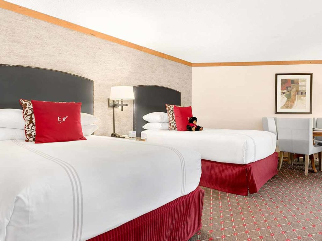 Guestroom with twin beds, at The Edgewater Hotel