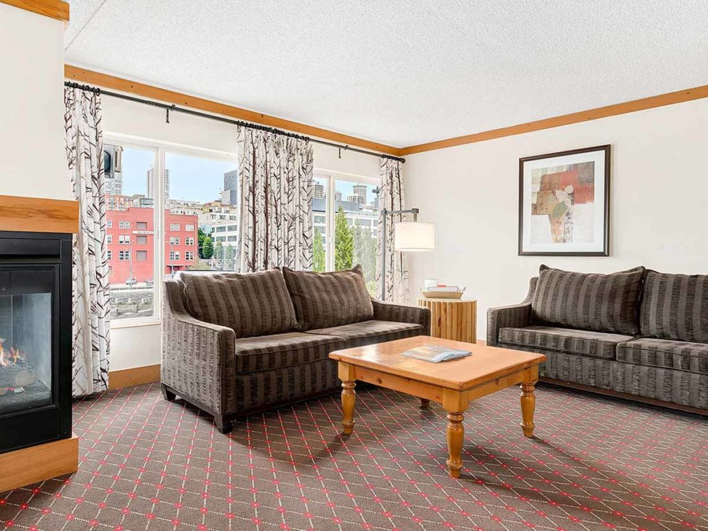 Guest room sitting area with city view.