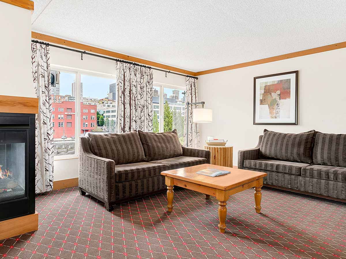 Guest room sitting area with city view.