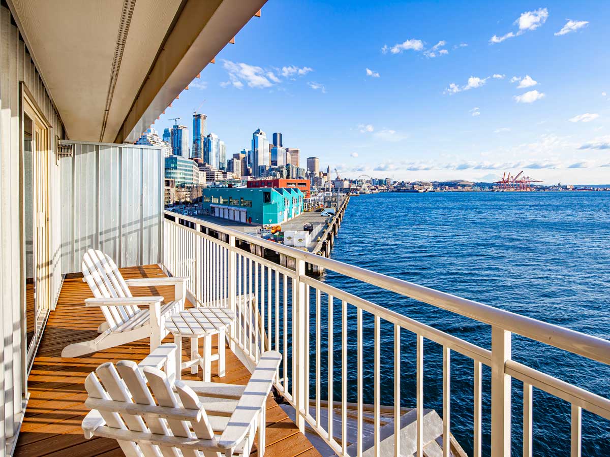 Guest room balcony over the water with Seattle views.