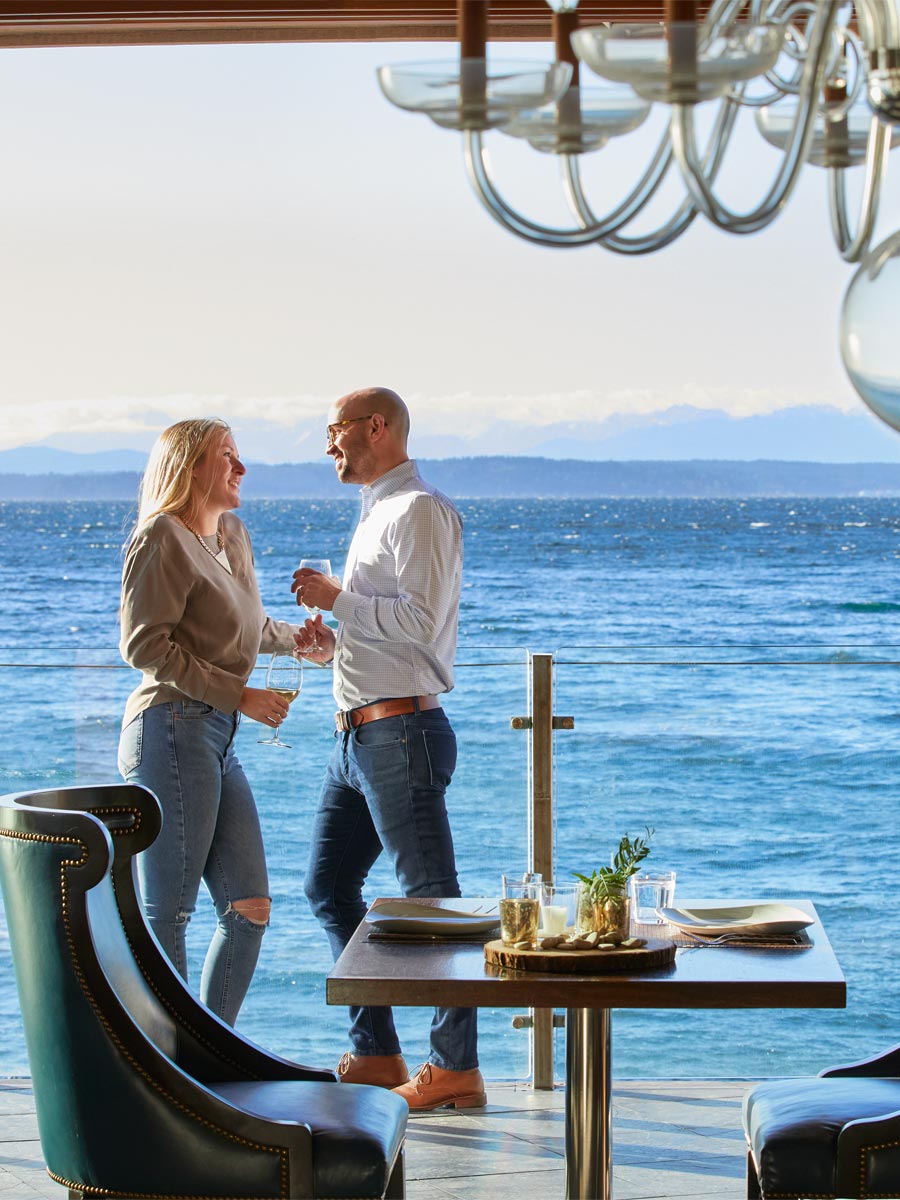 Couple Outside On The Balcony At Six Seven Restaurant.