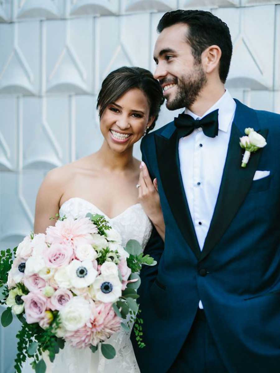 Bride And Groom With Flowers.