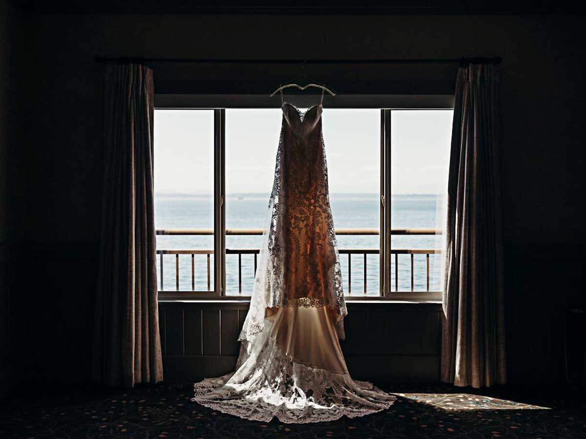 Wedding Dress Hanging In A Window.