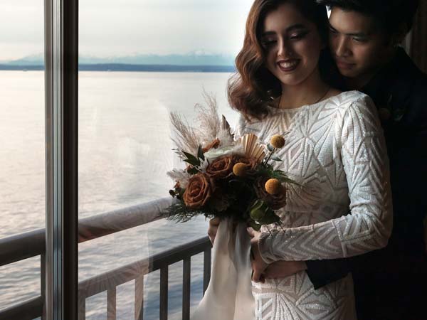 Bride And Groom In Front Of The Ocean.