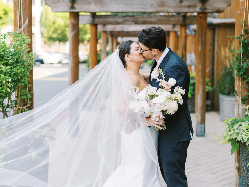 Bride And Groom Kissing.