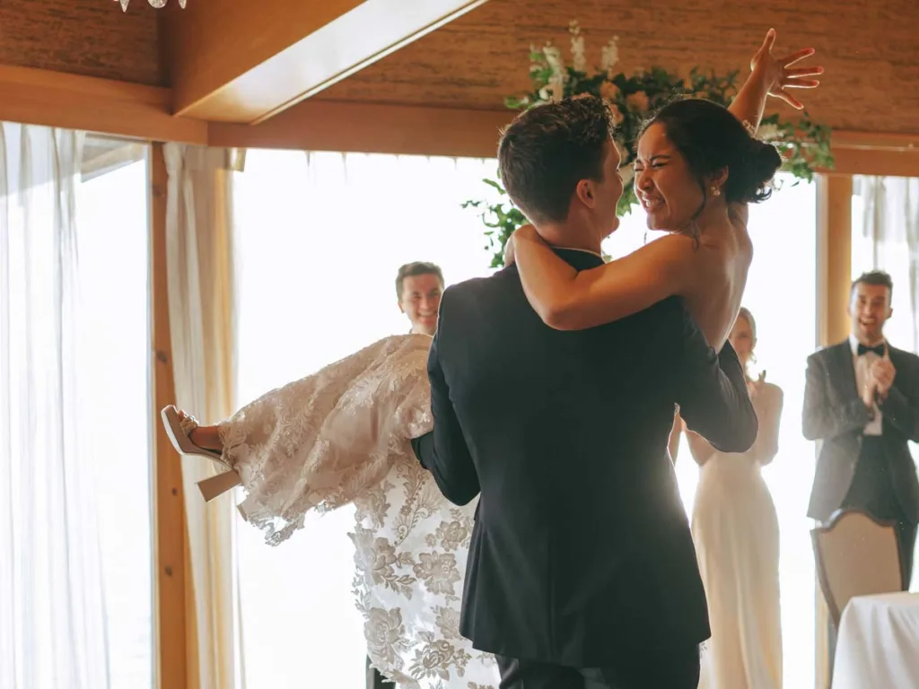 Groom Lifting Up Bride.