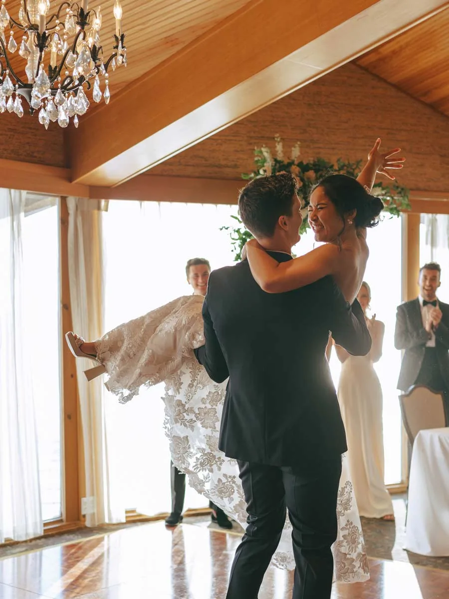 Groom Lifting Up Bride.
