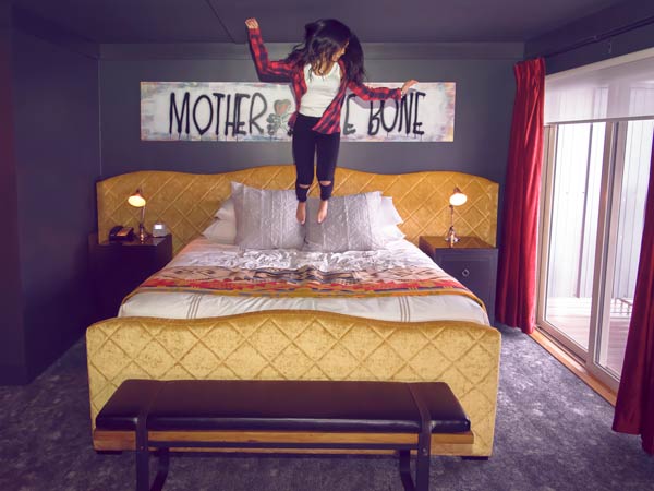 Lady Jumping On The Bed.
