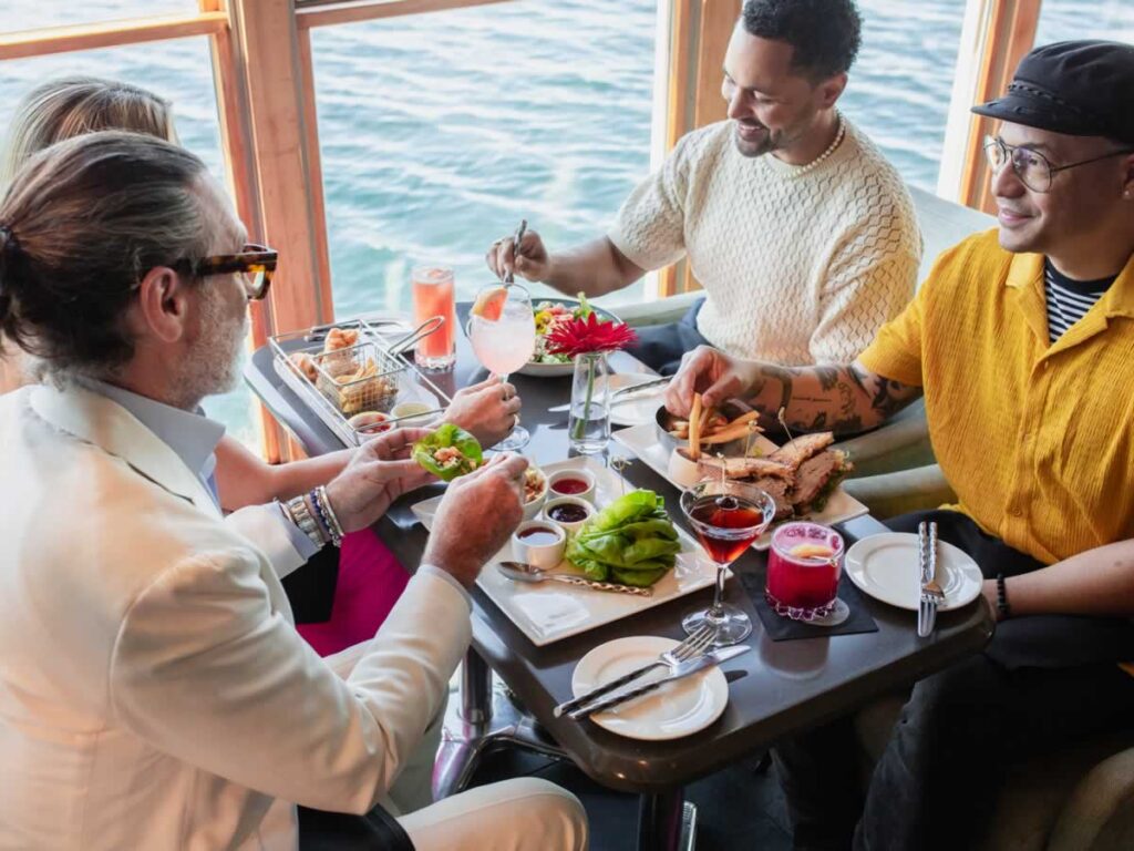 Friends dining with a view of Puget Sound at the Edgewater Hotel