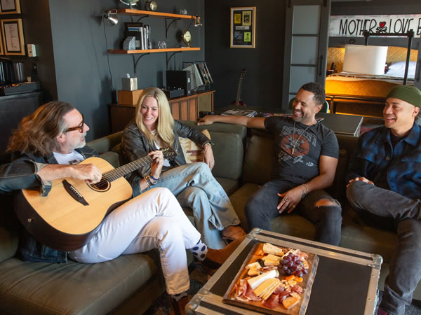 Friends enjoying a guitar jam session