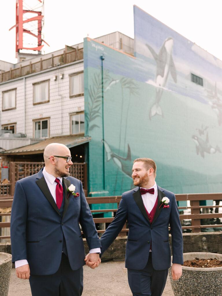 Grooms Walking Outside The Edgewater In Seattle